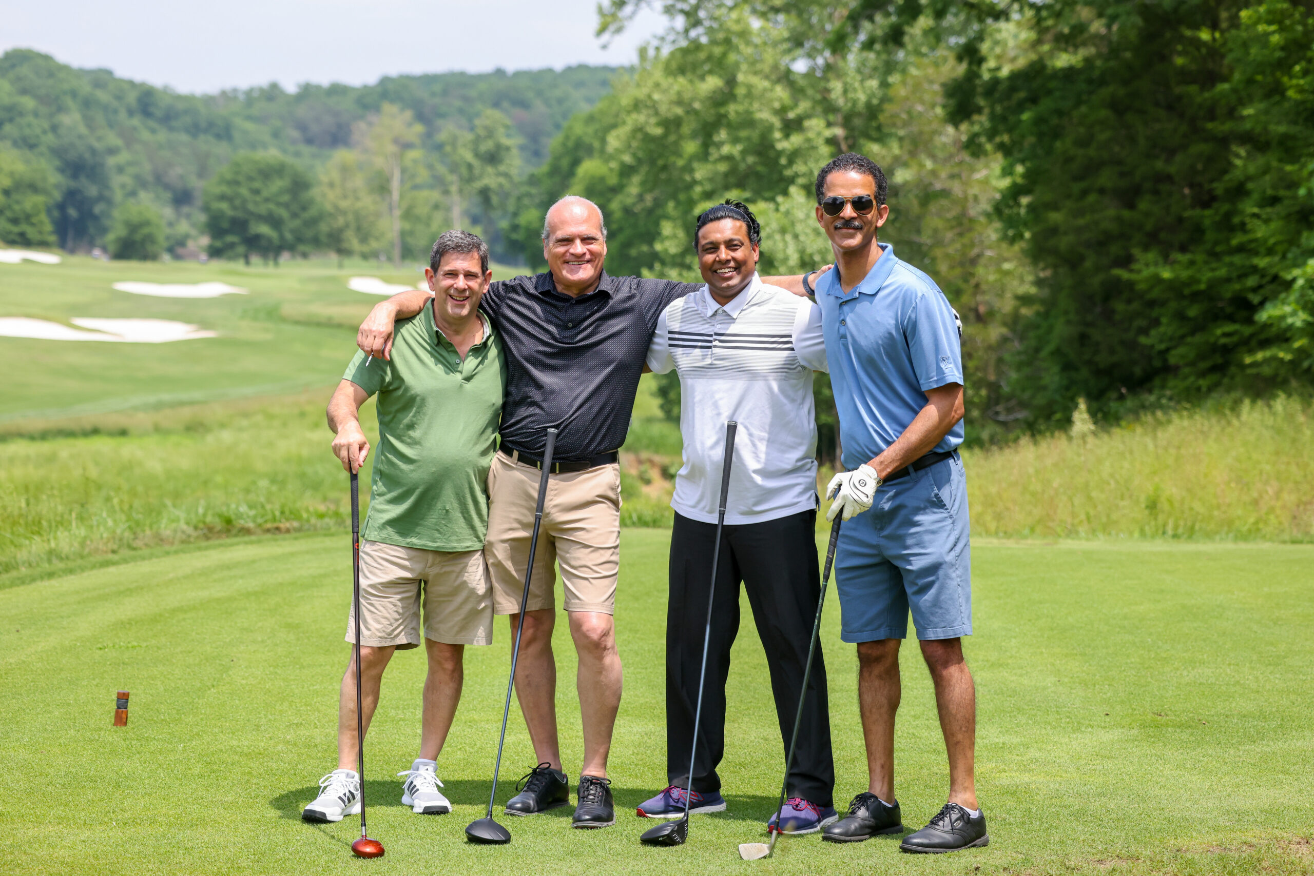 Four golfers at the HH Golf. L. Grossman Golf classic