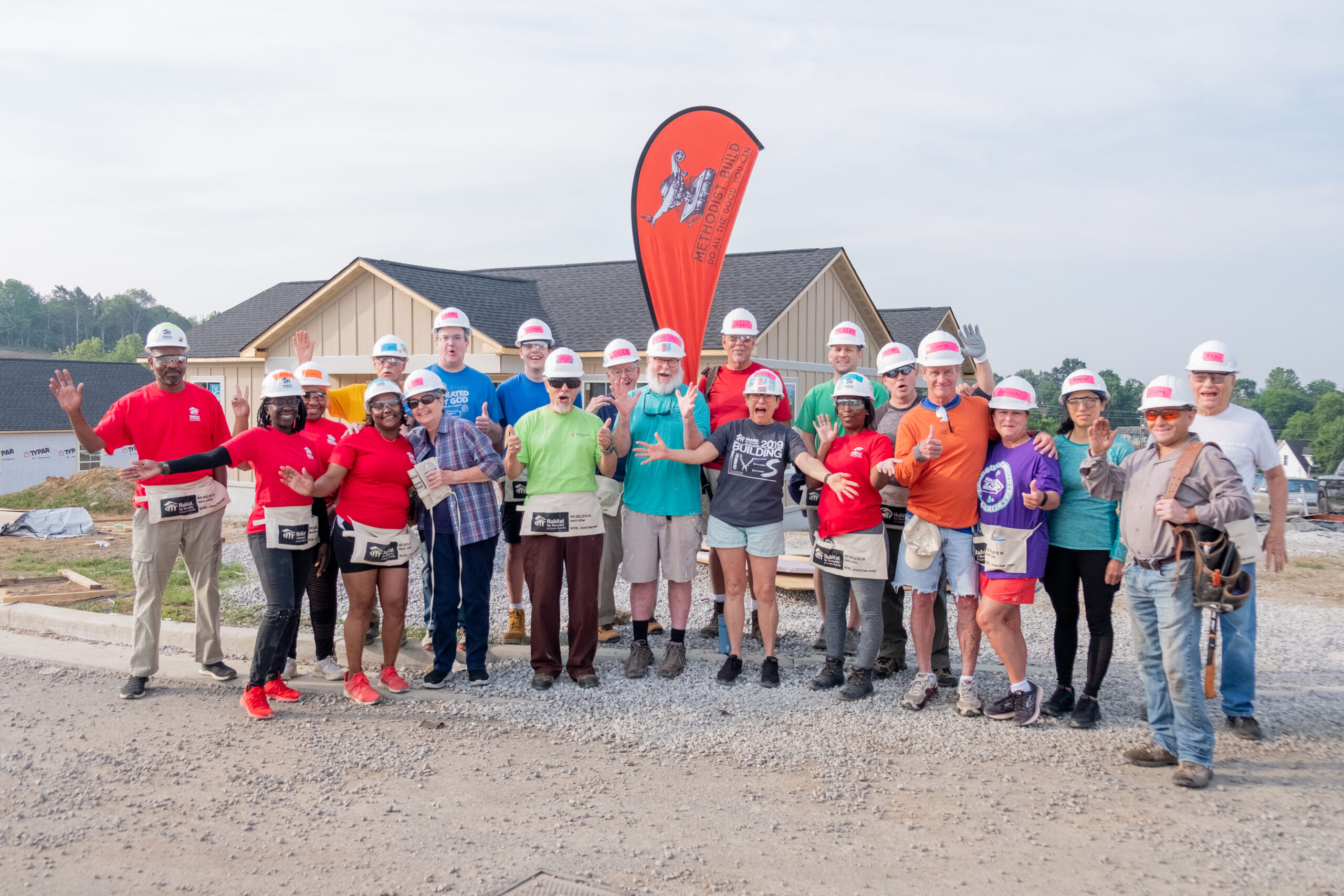 A group of volunteers on a future build site