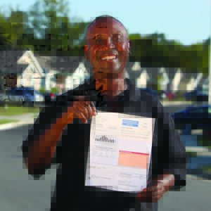 Habitat homeowner showing low electric bill